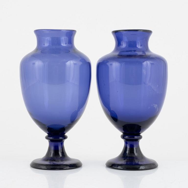 A matched pair of blue glass vases from around the year 1900.