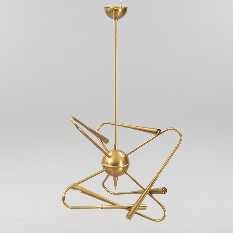 A mid 20th Century brass celiling light.