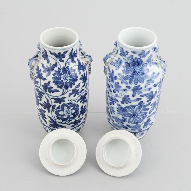 A pair of Chinese blue and white porcelain vases with covers, Qing dynasty, 19th century.