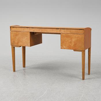 A 1940's table with pouf.