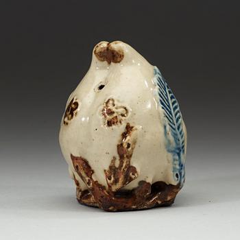 A stoneware peach-form water dropper, Choson period, 18th century. Korea.
