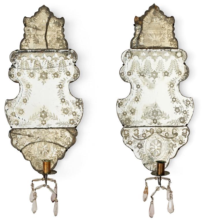 A pair of Baroque one-light girandole mirrors.