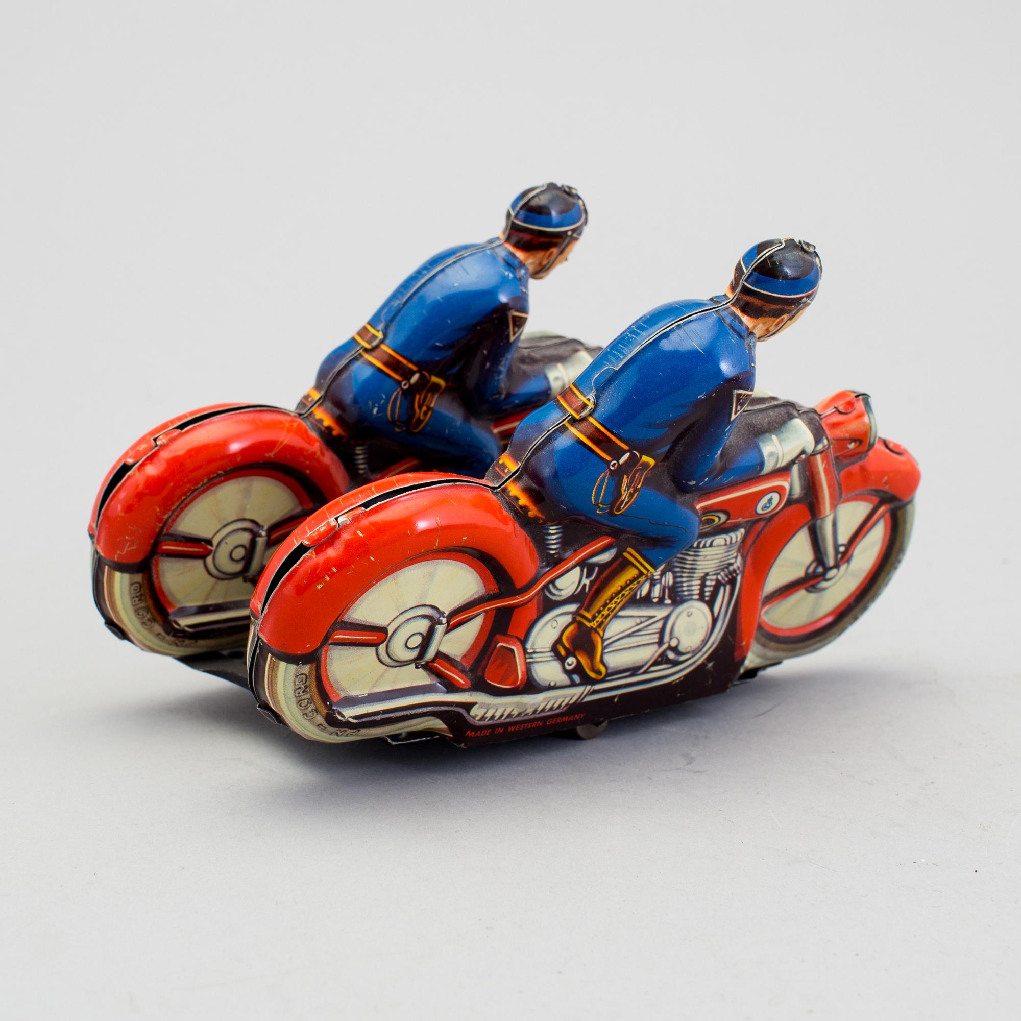 A tinplate synchronous motorcycle by Philipp Niedermeier, Germany, 1950s.