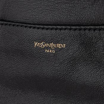 Yves Saint Laurent, a black leather bow bag.