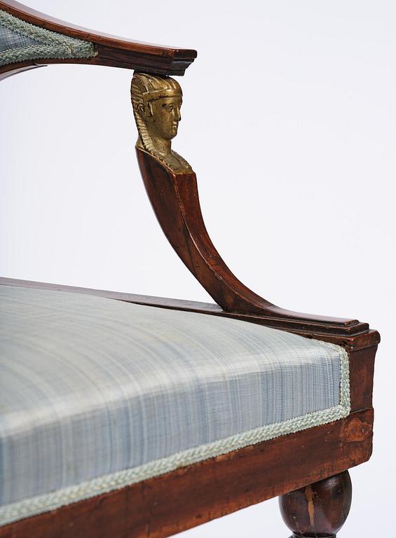 A pair of late Gustavian mahogny armchairs.