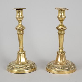 A pair of Louis Seize bronze candlesticks, late 18th century.