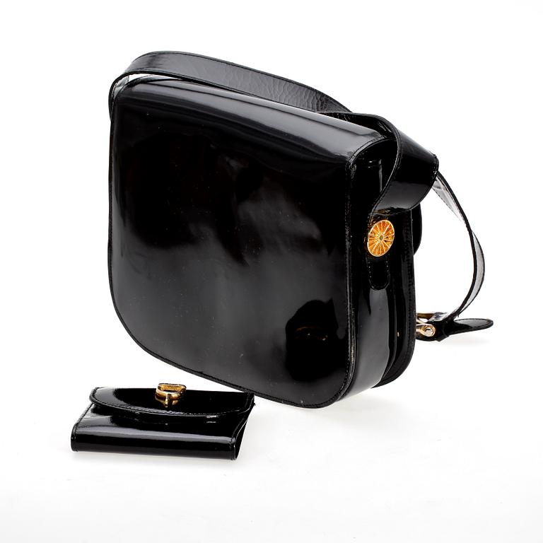 A black lacquer shoulderbag and purse by Celine.