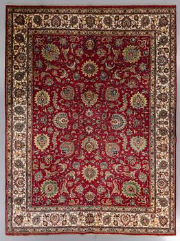 An old Tabriz carpet ca 400 x 300 cm.