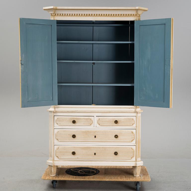 A gustavian style cabinet, circa 1900.
