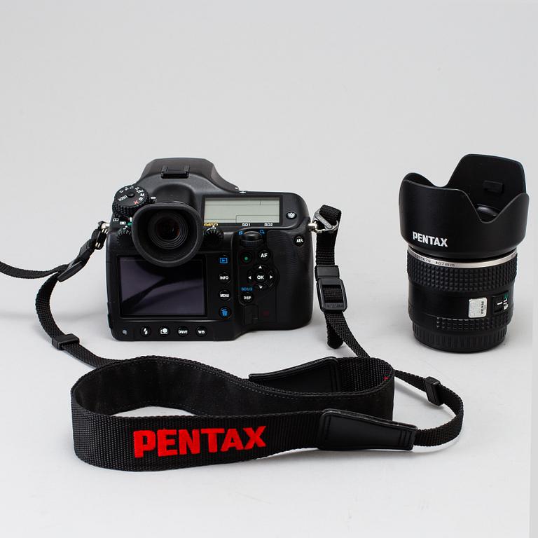 A black body medium format Pentax 645D camera with a SMC Pentax-D FA 645 55mm F2.8 AL [IF] SDM AW lens.