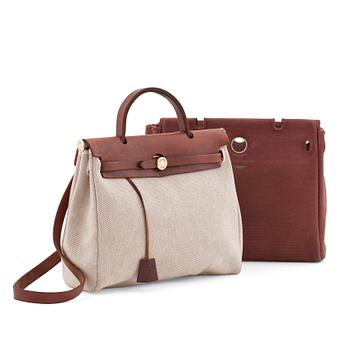 563. HERMÈS, a canvas and leather bag in two parts, "Herbag".