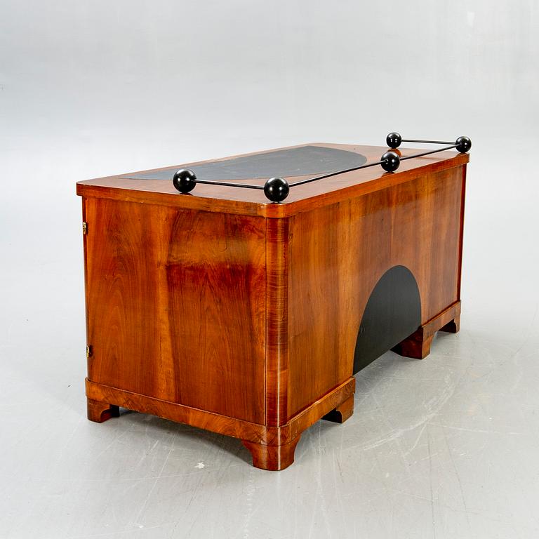 An Art Deco walnut desk.