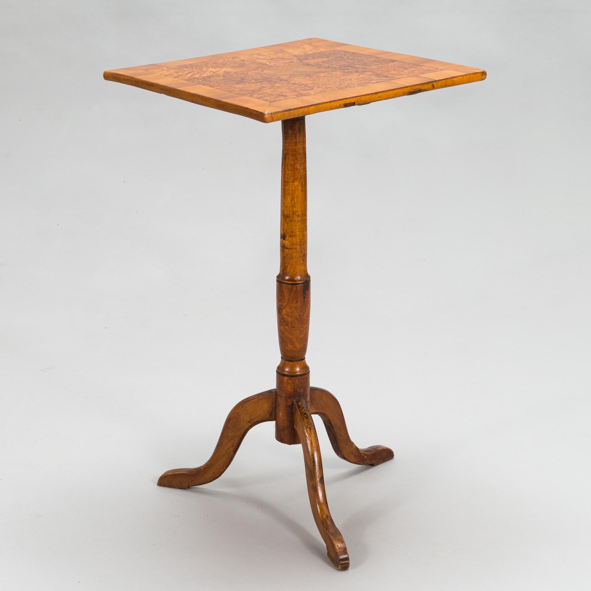 A tilt-top tripod table,  first half of the 19th century.