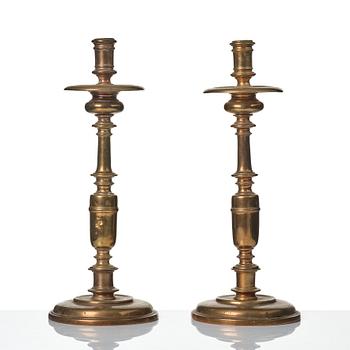 A pair of baroque brass candlesticks, 18th century.