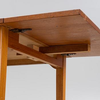 A teak veneered desk, mid 20th Century.