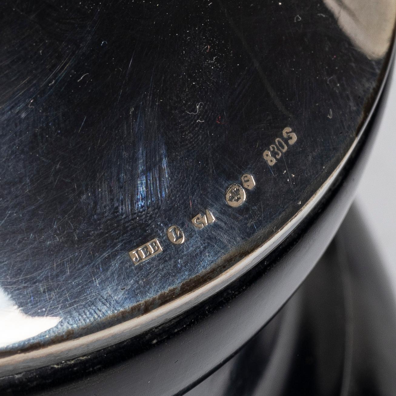 A cup and two plates, silver, second half of the 20th century.
