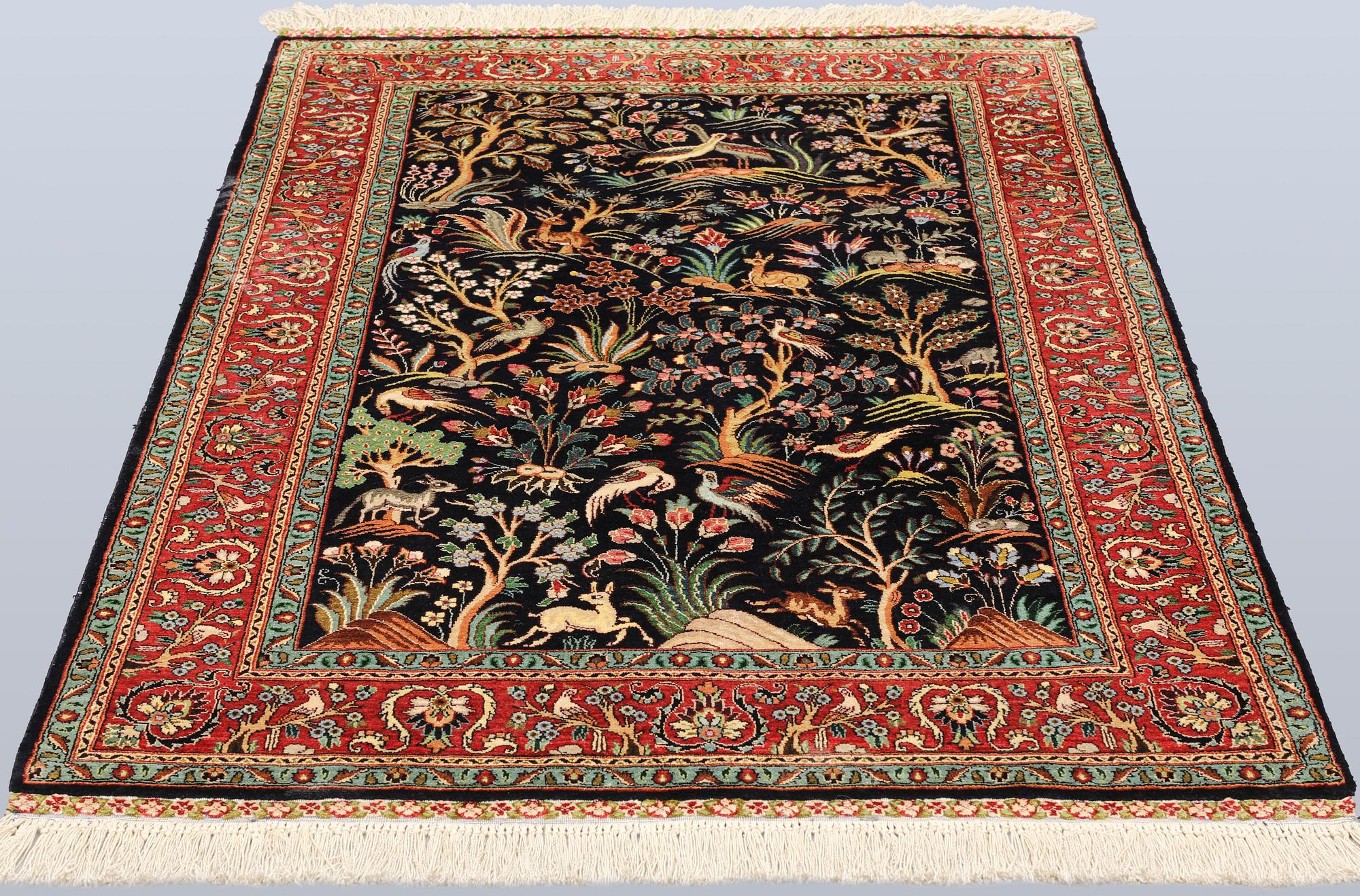 A Tabriz silk rug, approx. 155 x 100 cm.