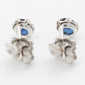14K white gold earrings with faceted sapphires.