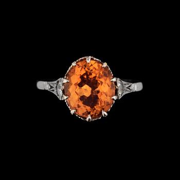 1202. A topaz ring set with diamonds.