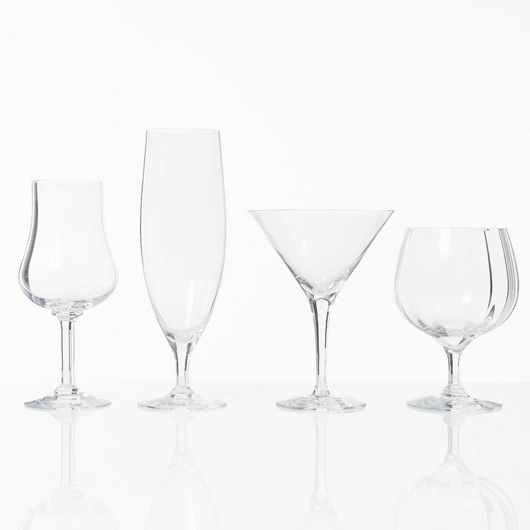 A set of 46 glass service parts, including 'Elixir Connoisseur' and Gunnar Cyrén, 'Optica', Orrefors.