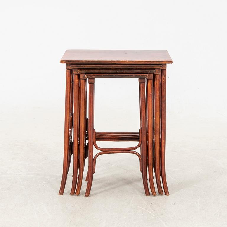 An early 19th century nest of four tables in stained beech from Thonet.