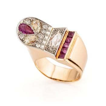 517. An 18K gold and platinum ring set with rubies and old-cut diamonds.