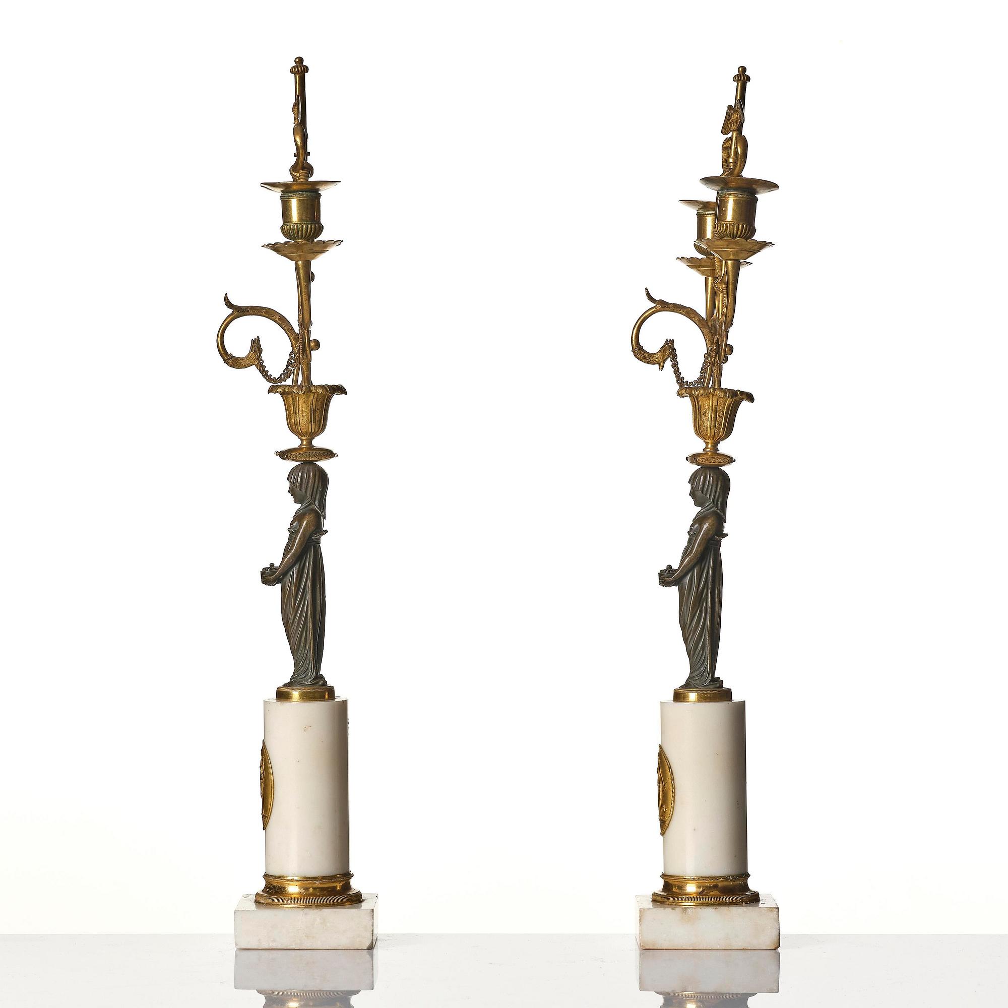 A pair of late Gustavian white marble and bronze candelabra.