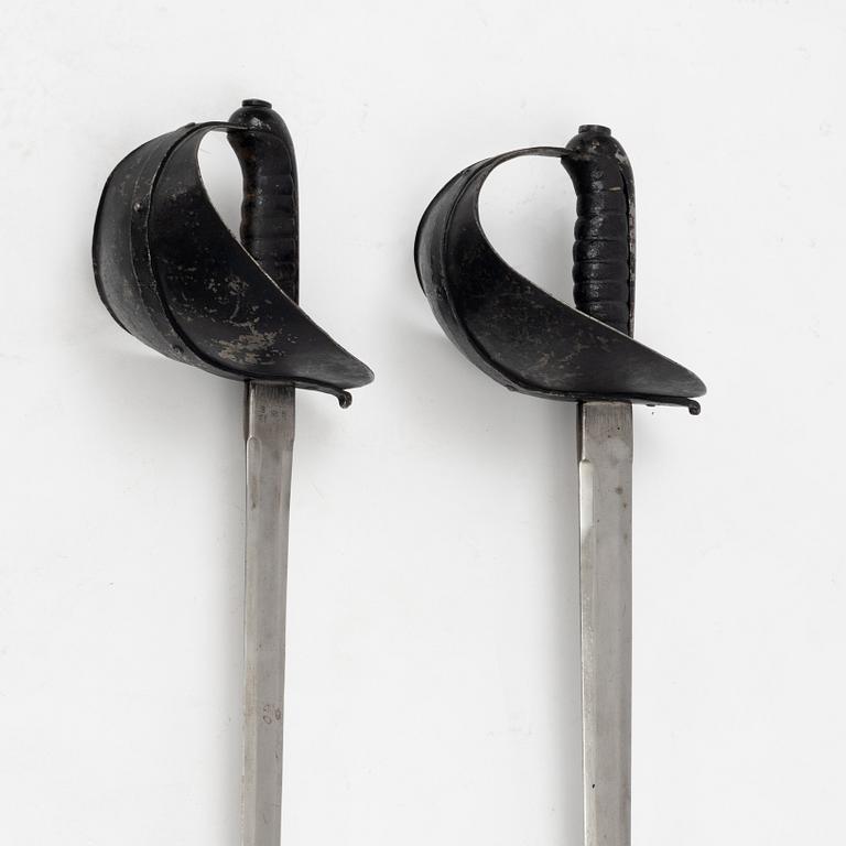 A Swedish pair of military practice swords 1886 pattern.