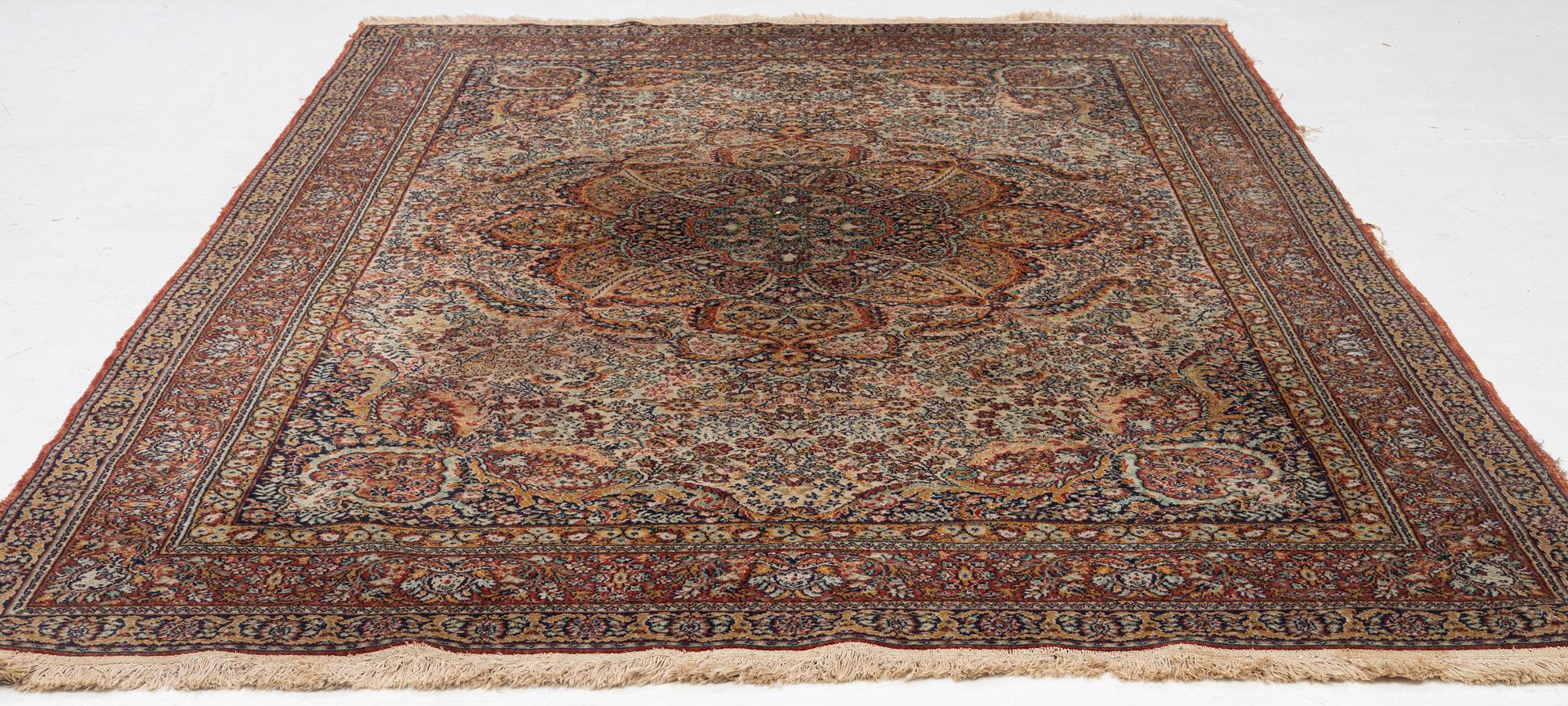 A semi-antique oriental carpet, c. 290 x 195 cm.