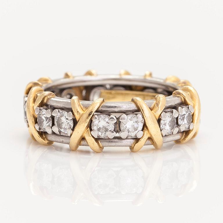 Tiffany & Co, a platinum and 18K gold 'Schlumberger' ring, with brilliant-cut diamonds.