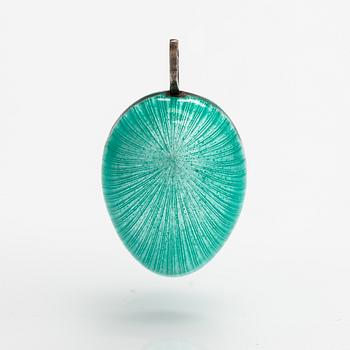 An egg shaped pendant made of silver and enamel. Tillander, Helsinki.