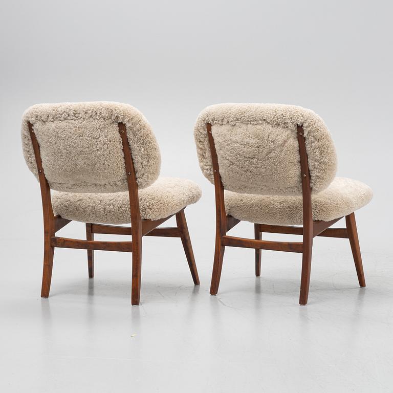 A pair of mid 20th century lounge chairs.