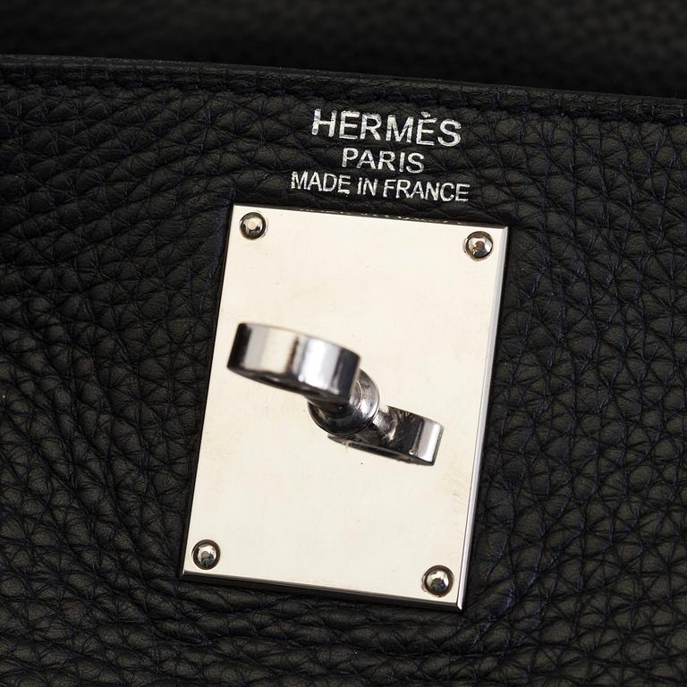 A black togo "JPG Shoulder Kelly 42" by Hermès 2009.