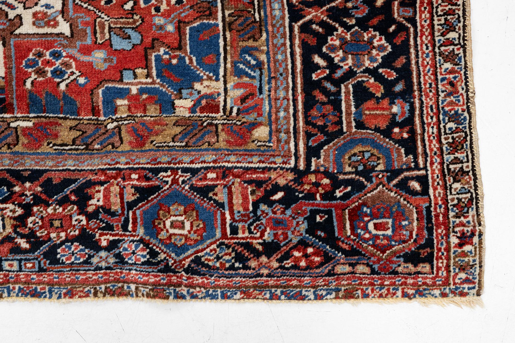 An antique Heriz carpet, west Persia, c. 333 x 238 cm.