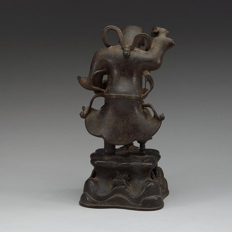 A bronze figure of Liu Hai with money and a three legged toad, Qing dynasty (1644-1912).