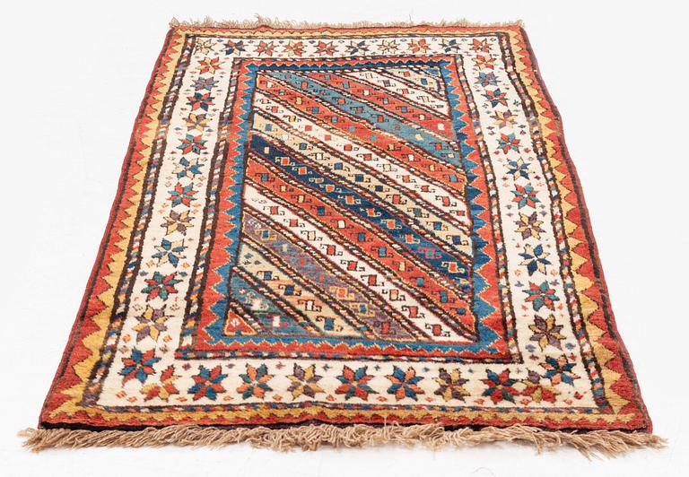 An antique Gendje rug, south Caucasus, c. 208 x 103 cm.