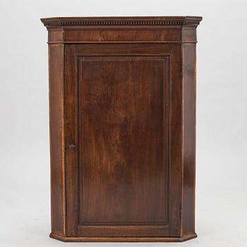 A 19th Century wall mounted corner cabinet.