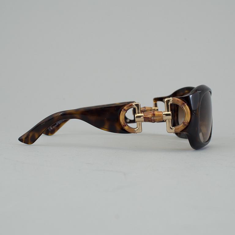 A pair of Gucci GG2970/S sunglasses with case.