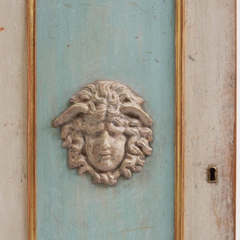 A pair of late Gustavian-style column-shaped cabinets, Stoockholm, early 19th century and later.