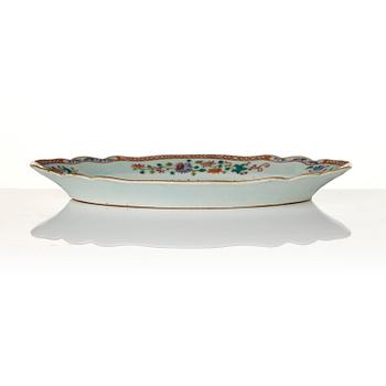 A group of famille rose 'double peacock' serving dishes, Qing dynasty, Qianlong (1736-95). (8 pieces).