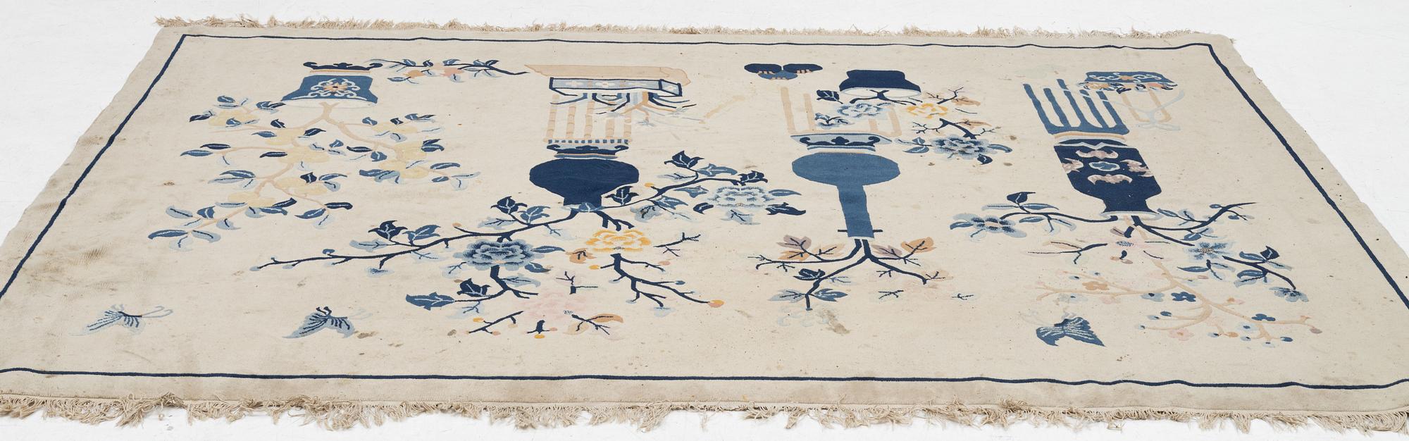 A semi-antique pictoral Chinese rug, approx. 240 x 170 cm.