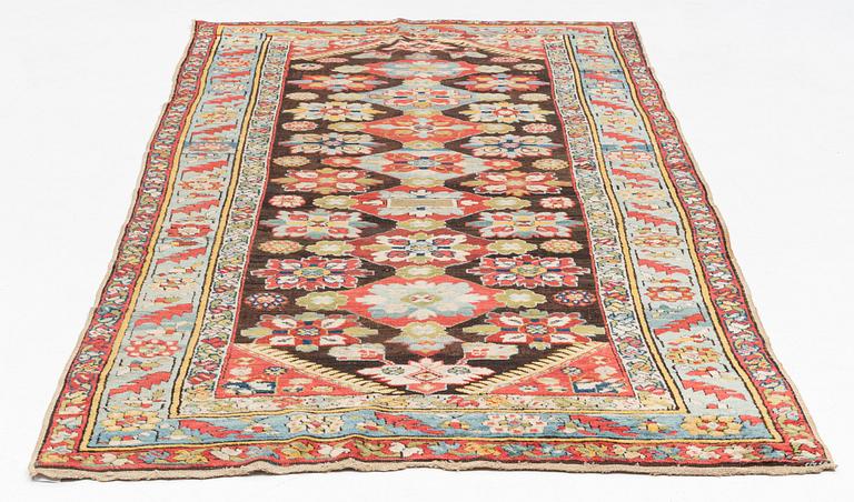 An antique Karabagh carpet,  ca 330 x 157 cm (one end with 1-3 cm flat weave).