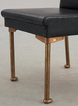 An Alvar Aalto bronze and black leather chair, Artek, Finland 1954.