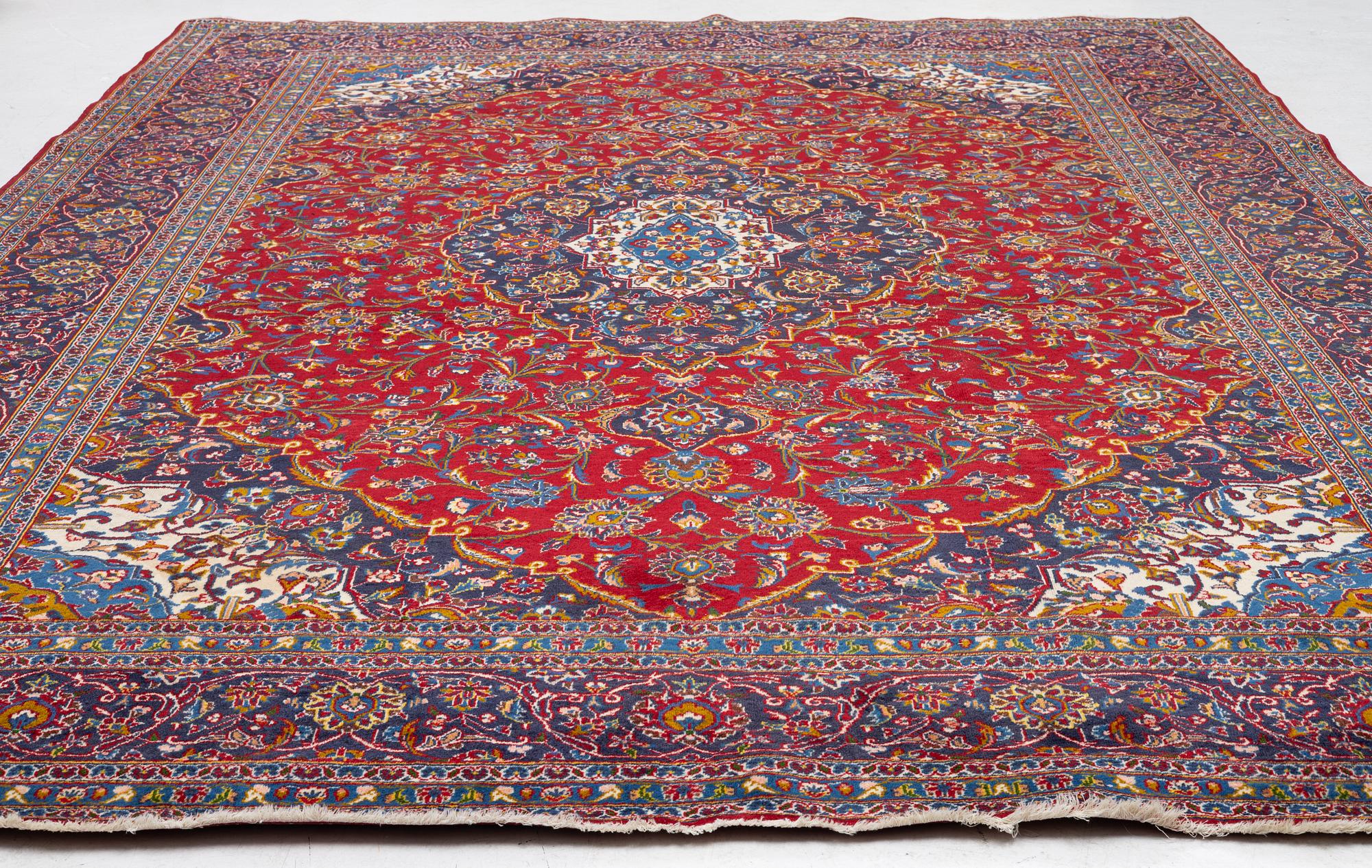 An Oriental carpet, c. 396 x 300 cm.