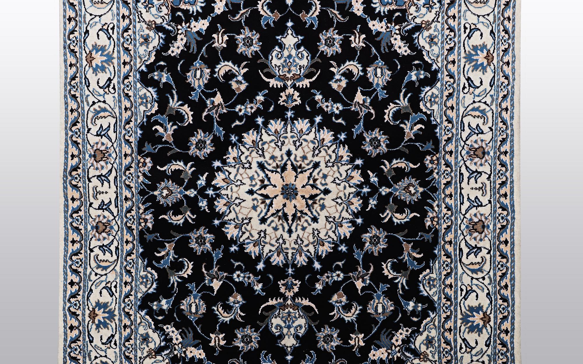 A rug, Nain, part silk, ca 242 x 167 cm.