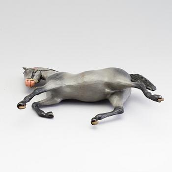 A painted tinplate toy horse ca year 1900.