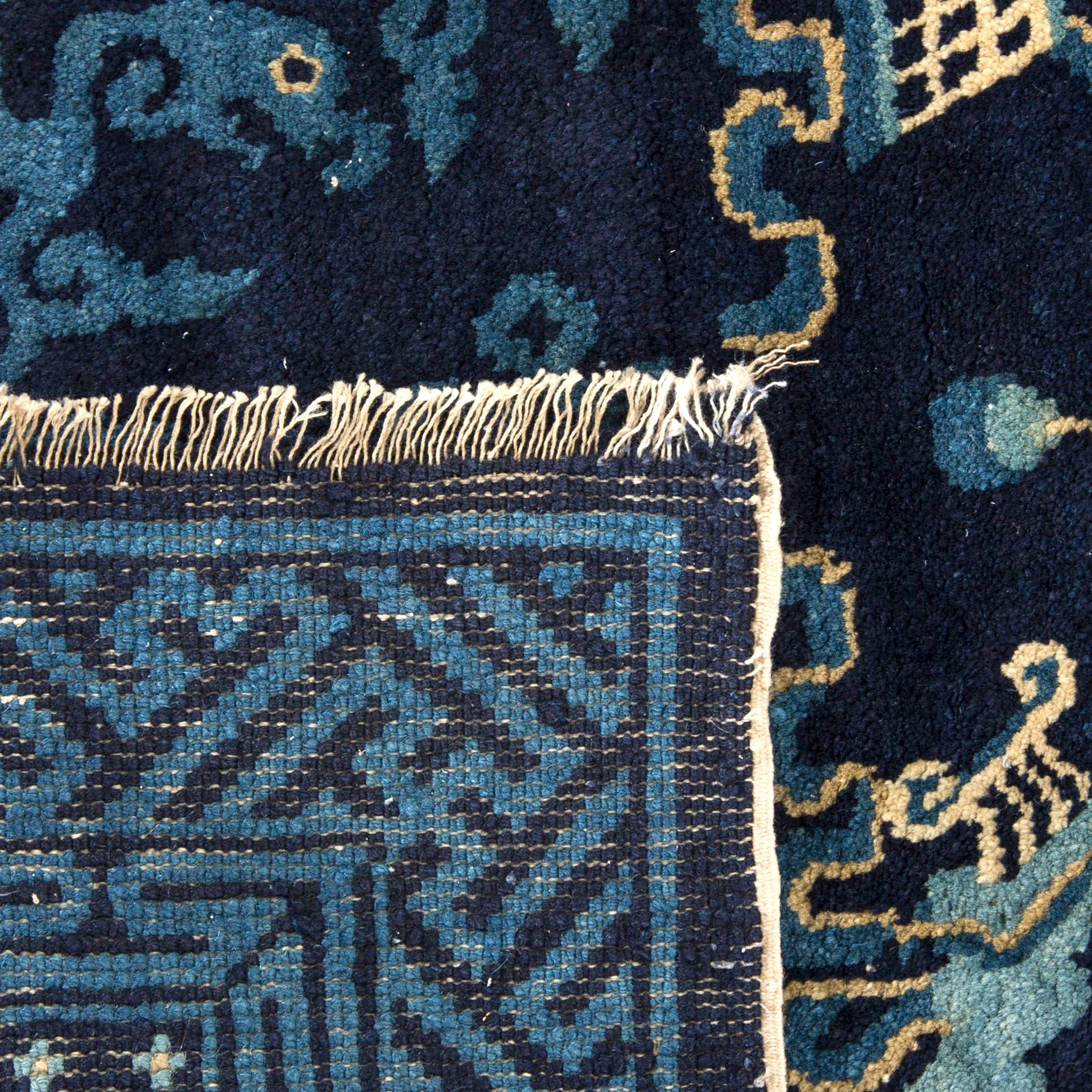 An antique Chinese Pao-Tou carpet ca 139 x 66 cm.