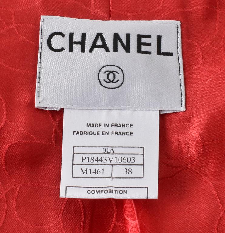 CHANEL, a red/orange bouclé jacket, autumn 2001.