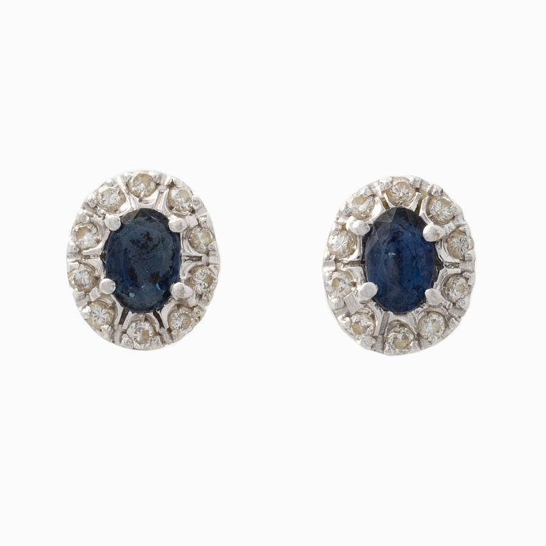 Pendant and a pair of earrings, white gold with sapphires and brilliant-cut diamonds.