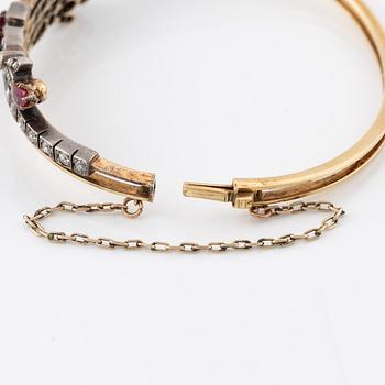 Arm ring in gold and silver set with old-cut and rose-cut diamonds and rubies.